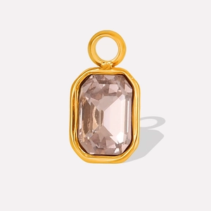 Detailed view of rectangular pink gemstone pendant with gold stainless steel setting