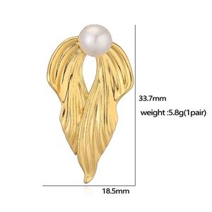 Detailed view of gold leaf earrings with pearl inlay including size and weight specs