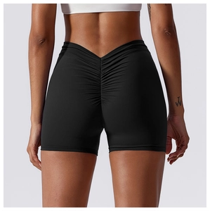 Close-up of black V-waist yoga shorts with scrunch butt detail and stretchy fabric
