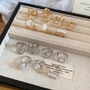 French retro gold and silver pearl ring set with geometric designs in a jewelry box