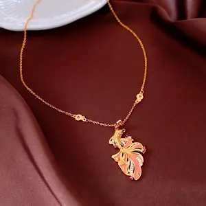 24K gold plated koi fish necklace with orange enamel and zircon on brown silk background