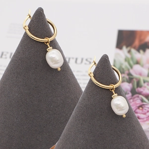 Golden stainless steel hoop earrings featuring natural white baroque pearl pendants