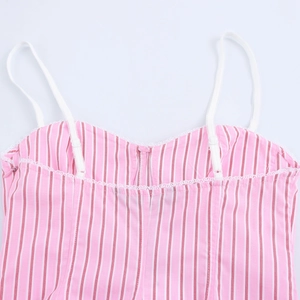 Detail of pink and white vertical stripes fabric with white lace trim on the strap camisole