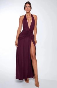 Detail view of deep purple halter neck dress with pleated waist and high leg slit