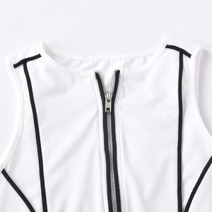 Macro shot of white ribbed knit top showing metal zipper and black stripe details