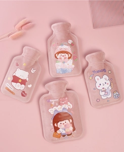 Flat lay of four pink plush cartoon hot water bags with bear and rabbit characters