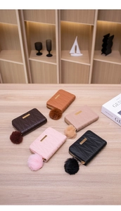 Quilted faux leather card holders in five colors with soft faux fur pompom charms