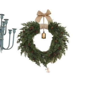 Natural Christmas wreath with pine cones, burlap bow, and hanging metal bell on white background