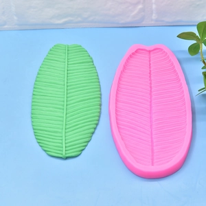 Pink silicone mold for banana leaf textures used in DIY soap and fondant crafts
