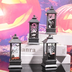 Detailed view of black Halloween lanterns with spooky patterns on vintage books background
