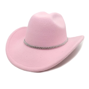 Close-up of pink wool felt cowboy hat featuring a sparkling silver rhinestone hatband