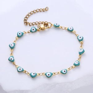 Detail of gold evil eye heart bracelet with blue enamel charms and lobster clasp closure