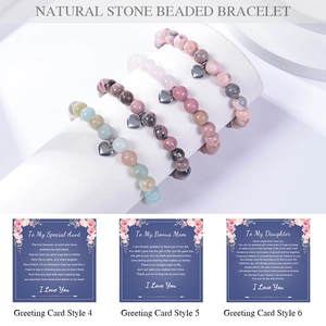 Detail of 8mm natural stone bead bracelets with silver heart charms on gift cards