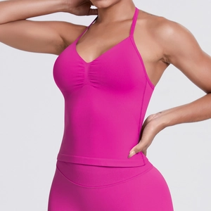 Detail of hot pink seamless sports tank top with gathered front and ribbed knit texture