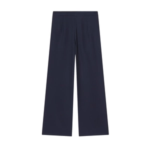 Detail view of high-waisted dark blue wide-leg trousers with elegant draped fabric
