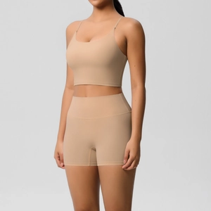 Detail of nude sports bra and high-waist biker shorts set with soft brushed fabric