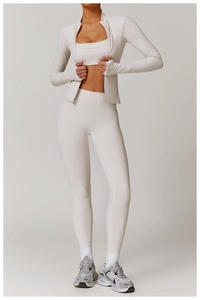 Detail of white yoga jacket showing zipper and functional thumbhole cuffs design