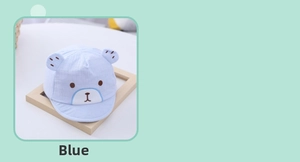 Detail of baby sun hat with embroidered bear face and soft 3D bear ears in blue cotton