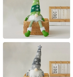 Detail of Christmas gnomes with knitted snowflake hats and long striped legs for decor