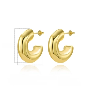Detailed view of hollow twisted 18k gold plated C-shape hoop earrings with zircon