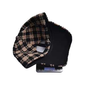 Detailed view of houndspur baseball cap on electronic scale weighing 106.1g