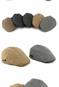 Detail of vintage plaid newsboy cap with adjustable metal side buckles in various colors