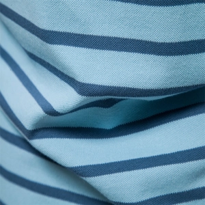 Macro shot of breathable blue and dark blue striped pique cotton fabric texture