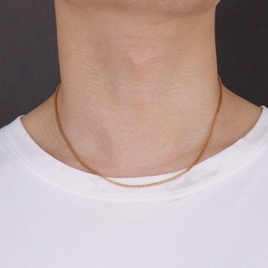 Minimalist gold titanium corn chain necklace for women and men shown on a model