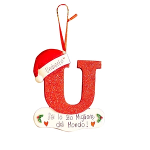 Detail of red glitter letter U Christmas ornament with Umberto name and Italian greeting