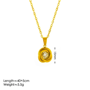 Golden necklace with round knot pendant and sparkling crystal on white background