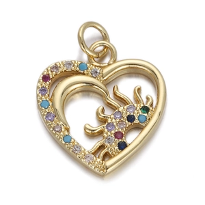 Detail of a golden heart pendant with sun and moon motifs and multicolored gemstones
