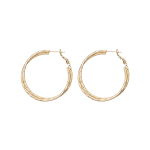 Minimalist golden hoop earrings with textured grainy finish and intertwined rope design