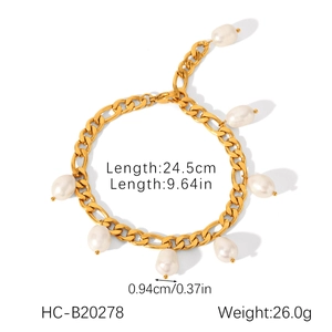 Detailed view of golden Figaro chain bracelet with seven natural white baroque pearl charms