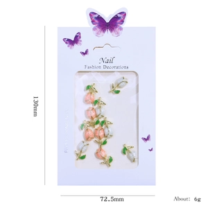 Tulip rabbit nail art charms with golden alloy base and green leaves in card packaging