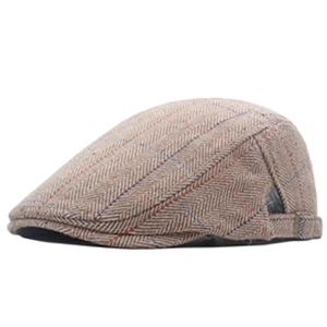 Detail of vintage herringbone ivy cap featuring classic windowpane tweed texture