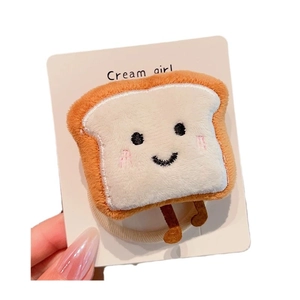 Cute plush toast hair tie for ponytails featuring an embroidered smiling face and soft fabric