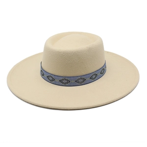 Beige wool felt fedora with a blue geometric patterned band against a white background