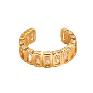 Detail of gold ear cuff featuring a continuous row of rectangular cubic zirconia stones