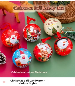 Close-up of spherical Christmas tin gift boxes with festive patterns and silk hanging ribbons