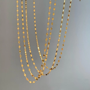 Dual-layer golden lip-link snake chain necklace with a luxury polished mirror finish