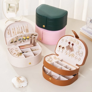 Multi-layer jewelry box in various colors showing internal storage and snap closure
