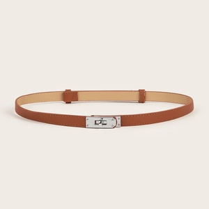 Detail of slim brown leather belt with silver twist lock buckle for waist adjustment