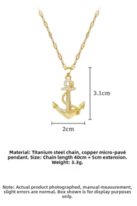 Vue détaillée du collier ancre dorée avec dimensions 3,1x2cm et chaîne de 40+5cm