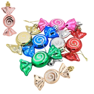 Colorful candy-shaped Christmas tree ornaments with glitter spirals and electroplated finish