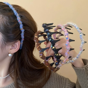 Detail of colorful woolen wavy hair combs showing textured yarn and anti-slip teeth