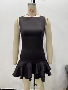 Detail of a black sleeveless mini dress with layered ruffles and slim fit design