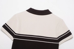 Close-up of the back polo collar and textured rib-knit black and white striped fabric