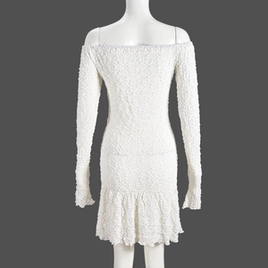 Close-up of the back view showing textured 3D stretch fabric and ruffled hemline