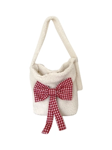 White faux fur tote bag with a red checkered bow decoration and plush shoulder strap