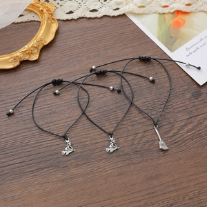Three-piece Halloween witch and broom charms on black woven ropes with gift card